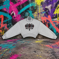 Gray ADHD Diamond Roses cropped mock neck sweatshirt against a colorful graffiti wall